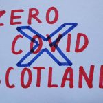 An image reading 'Zero Covid Scotland' with a Saltire flag superimposed