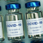 A stock photo of COVID-19 vaccine ampules.